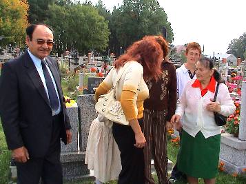 THE CHOWANIEC FAMILY VISITING THE PARISH CEMETERY by Jan Olko, 2006